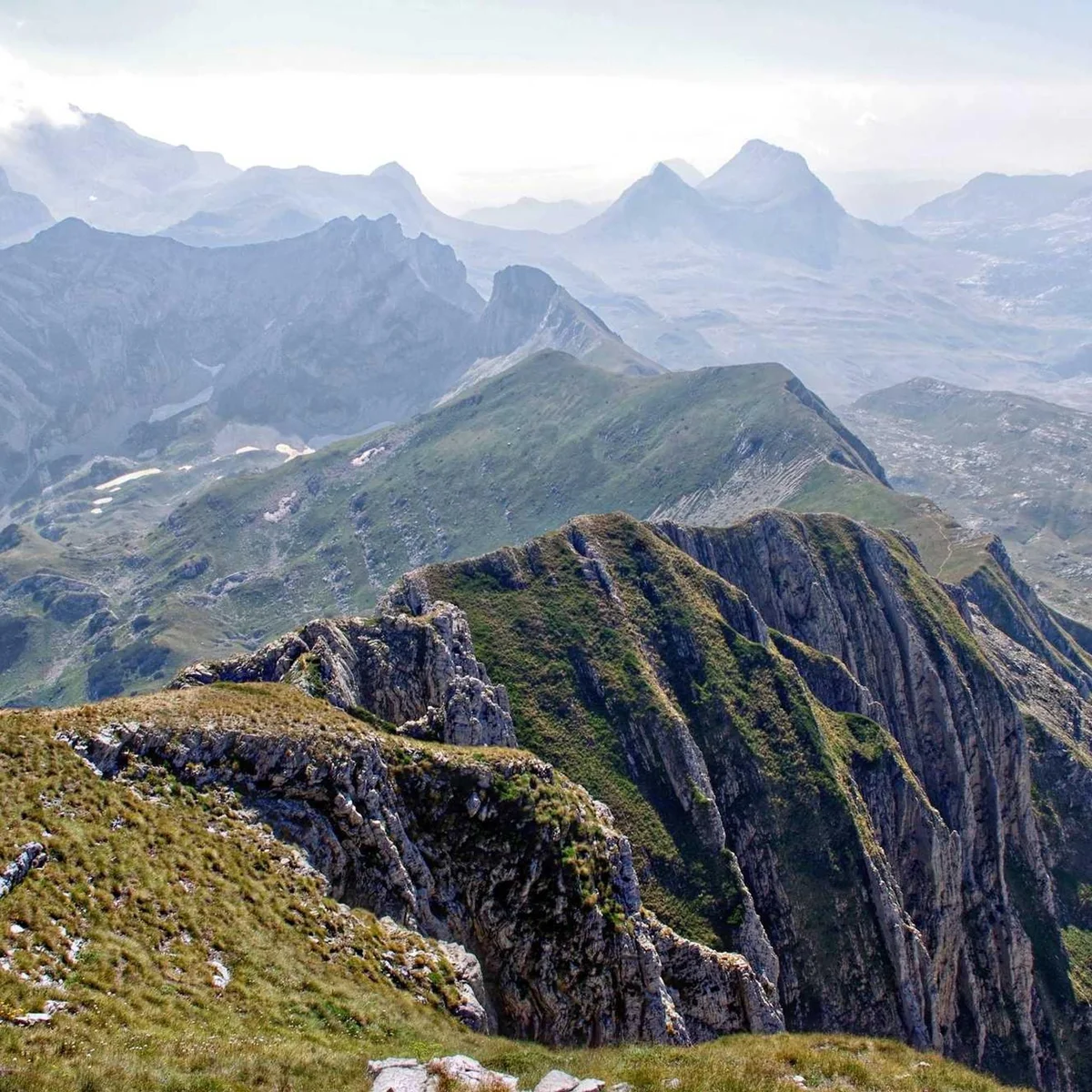 Mountain Range Layered Peaks Hiking Landscape Layered mountain ridges receding into misty distance showing dramatic terrain
